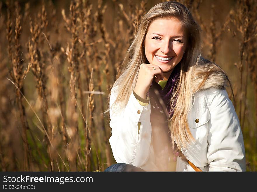 Caucasian young adult blond woman outdoor fall time