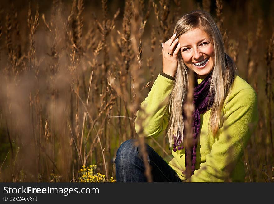 Caucasian young adult blond woman outdoor fall time