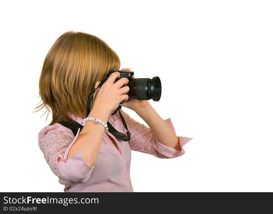 Girl on a white background, holding a camera in his hands. Girl on a white background, holding a camera in his hands