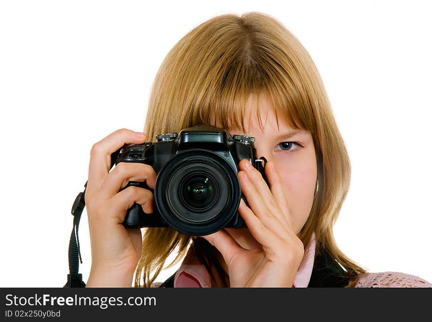 Girl on a white background, holding a camera in his hands. Girl on a white background, holding a camera in his hands