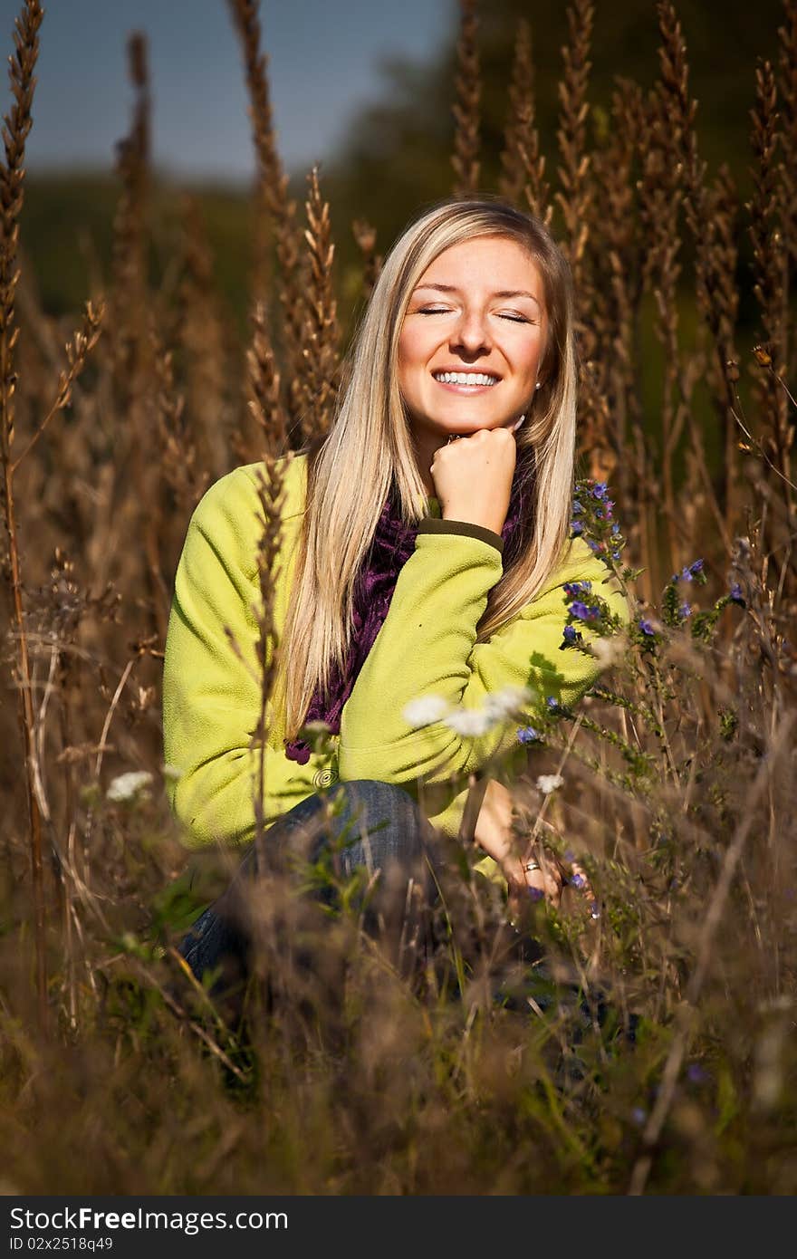 Caucasian young adult blond woman outdoor fall time