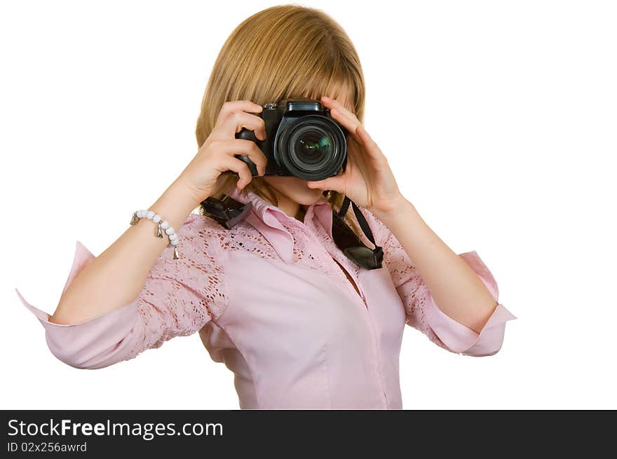 Girl on a white background, holding a camera in his hands. Girl on a white background, holding a camera in his hands