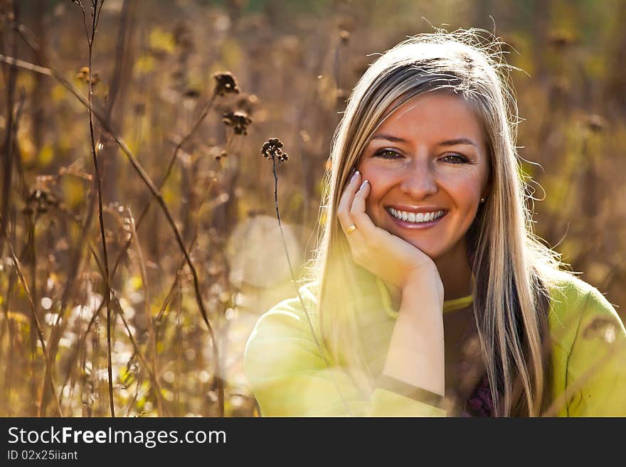 Caucasian young adult blond woman outdoor fall time