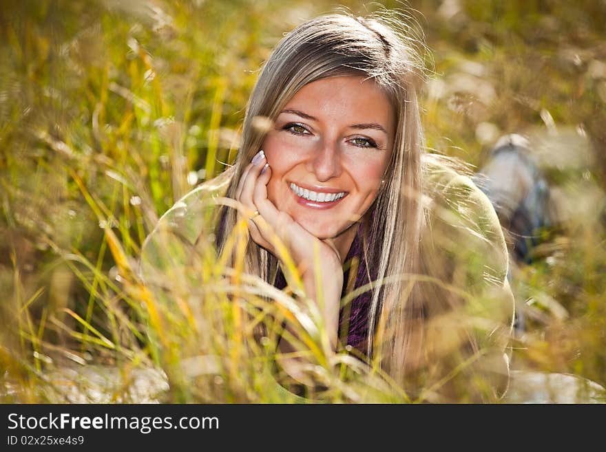 Caucasian young adult blond woman outdoor fall time