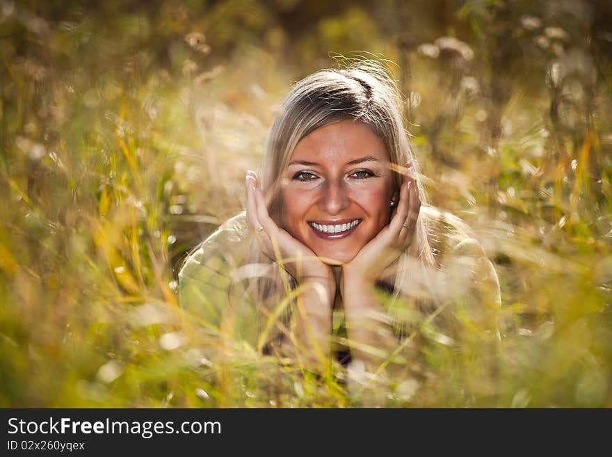 Caucasian young adult blond woman outdoor fall time