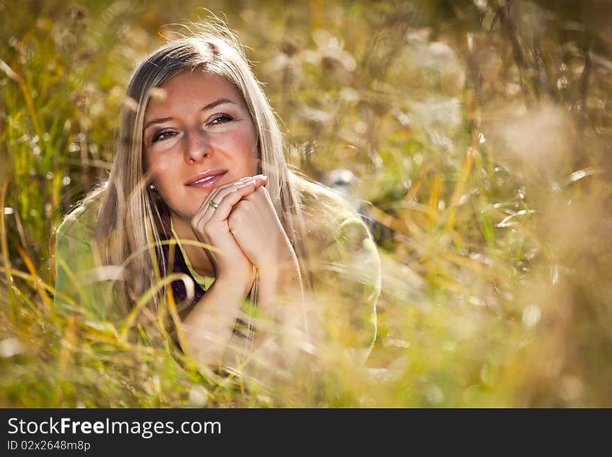 Caucasian young adult blond woman outdoor fall time