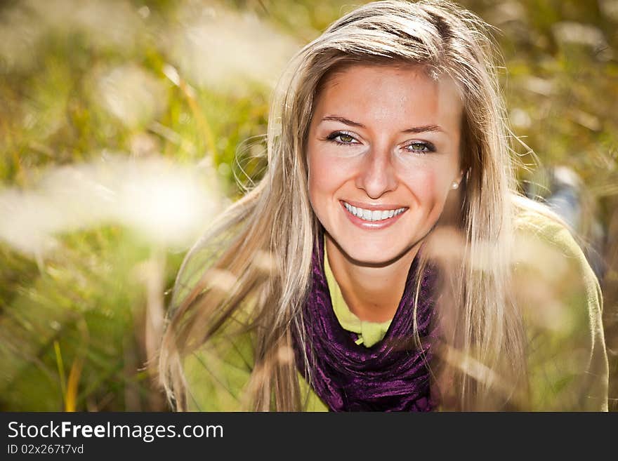 Caucasian young adult blond woman outdoor fall time