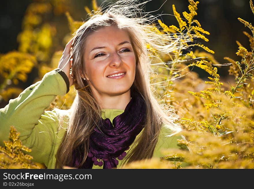 Caucasian young adult blond woman outdoor fall time