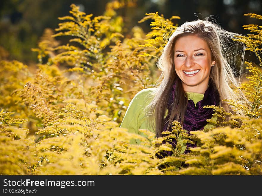 Caucasian young adult blond woman outdoor fall time