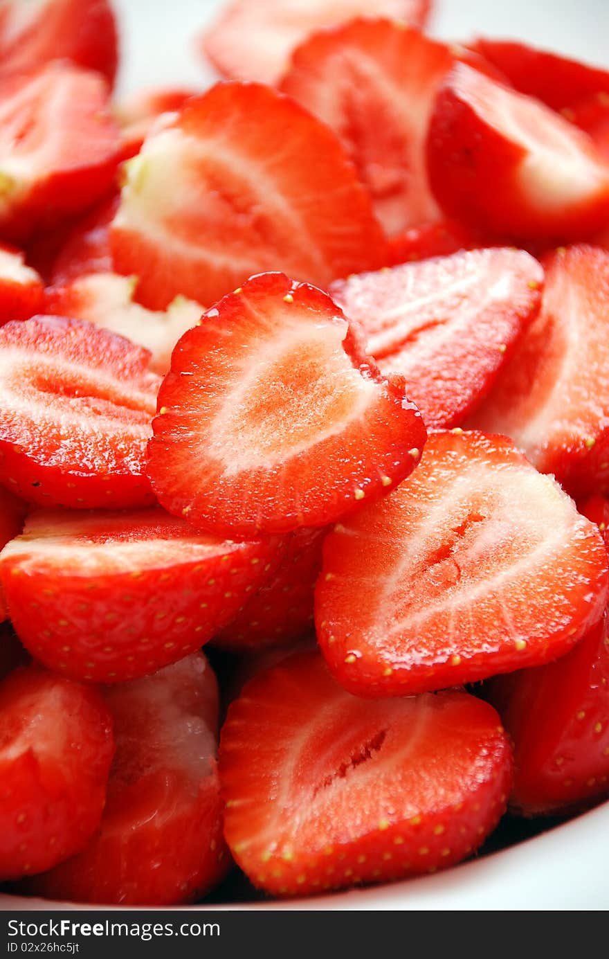 Strawberries cut in half, close-up shot. Strawberries cut in half, close-up shot