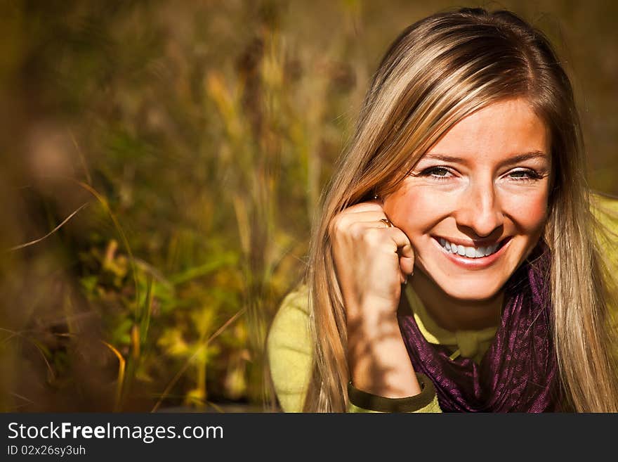 Caucasian young adult blond woman outdoor fall time