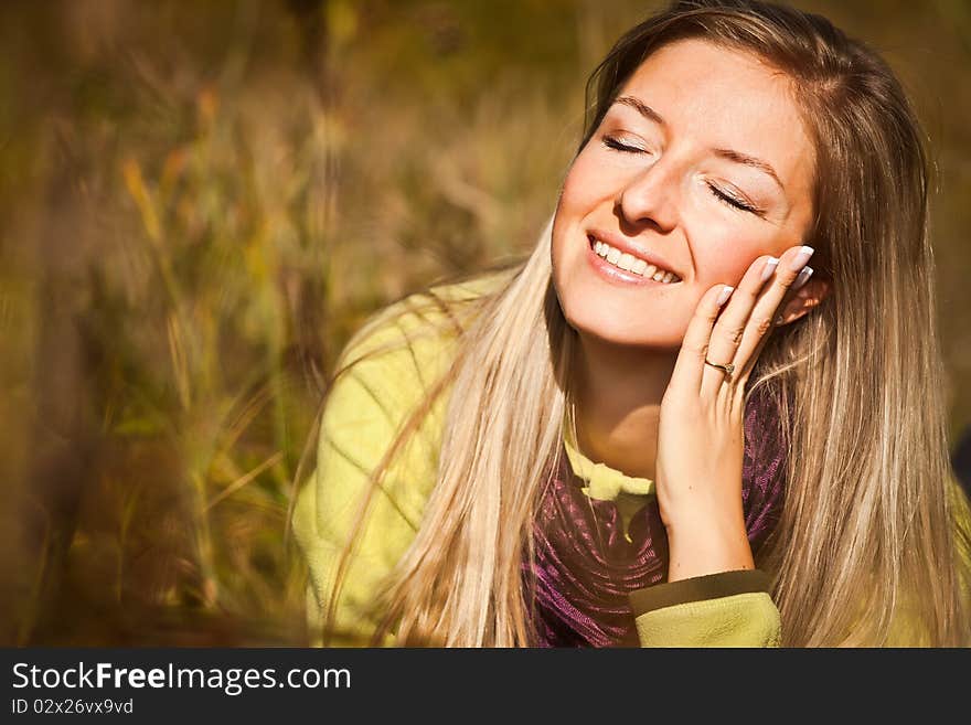 Caucasian young adult blond woman outdoor fall time