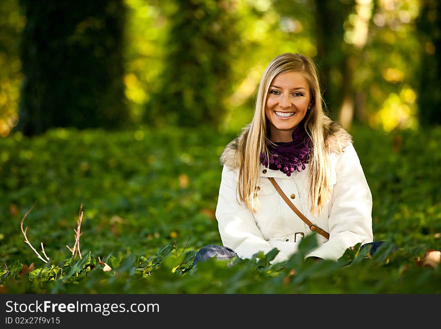 Caucasian young adult blond woman outdoor fall time