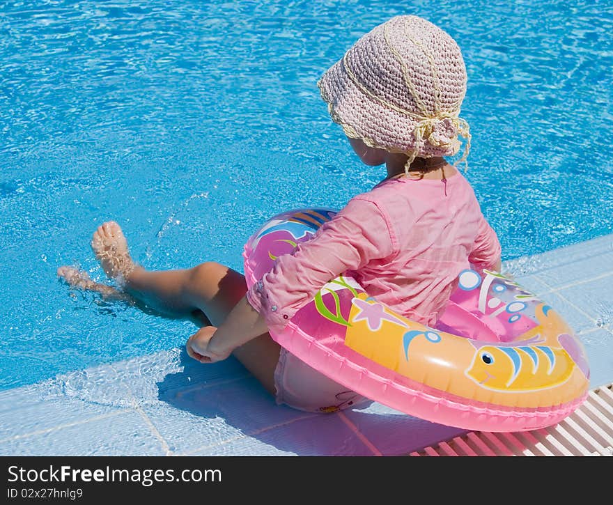 Little Girl With Inflatable Circle At Pool