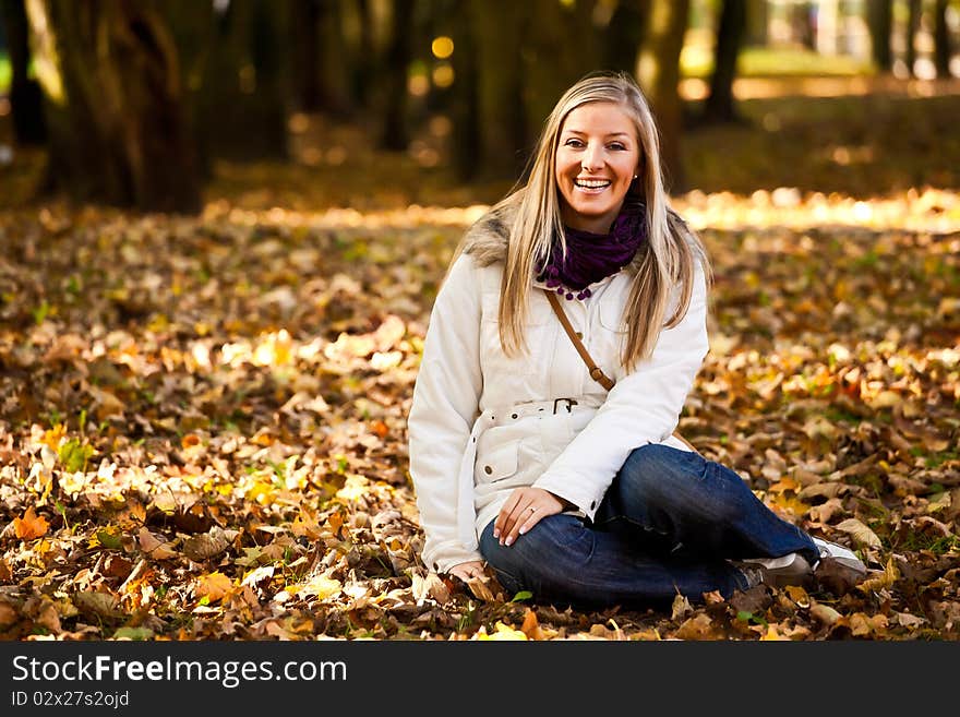 Caucasian young adult blond woman outdoor fall time