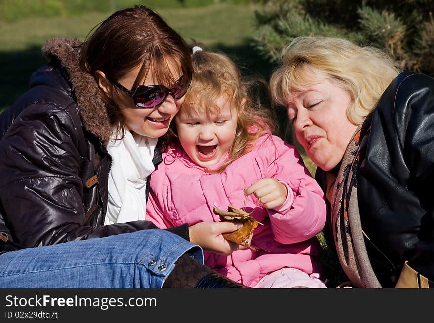 Happy family in autumn park outdoor