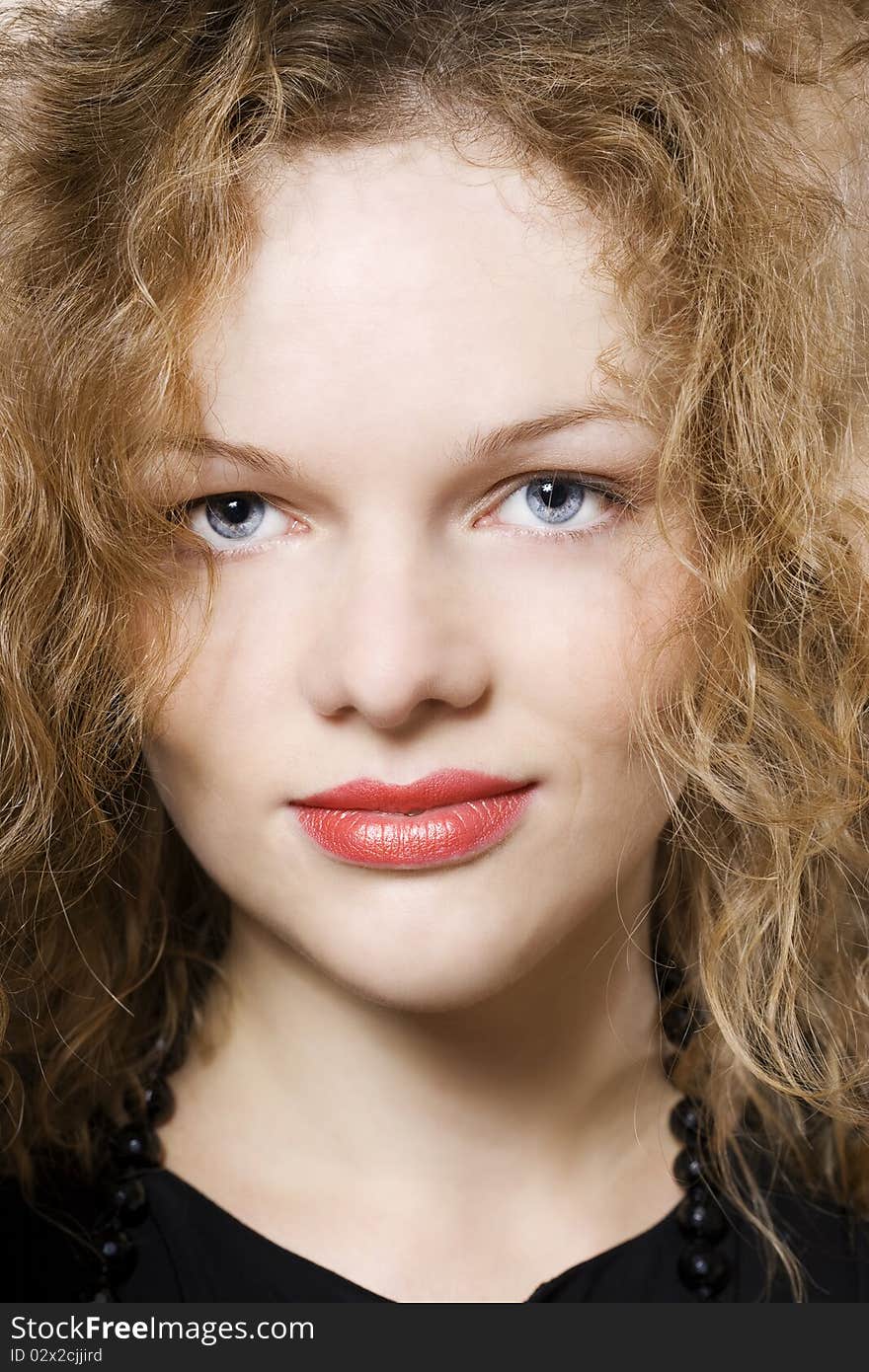 Young Woman With Curly Hairs