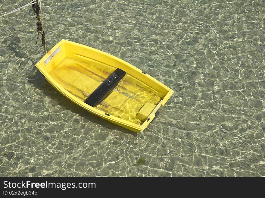 Yellow boat, green sea