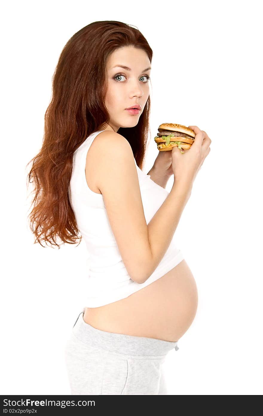 Pregnant eats sandwich