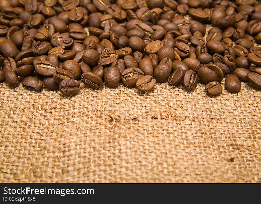 Grains of coffee on a background rough material