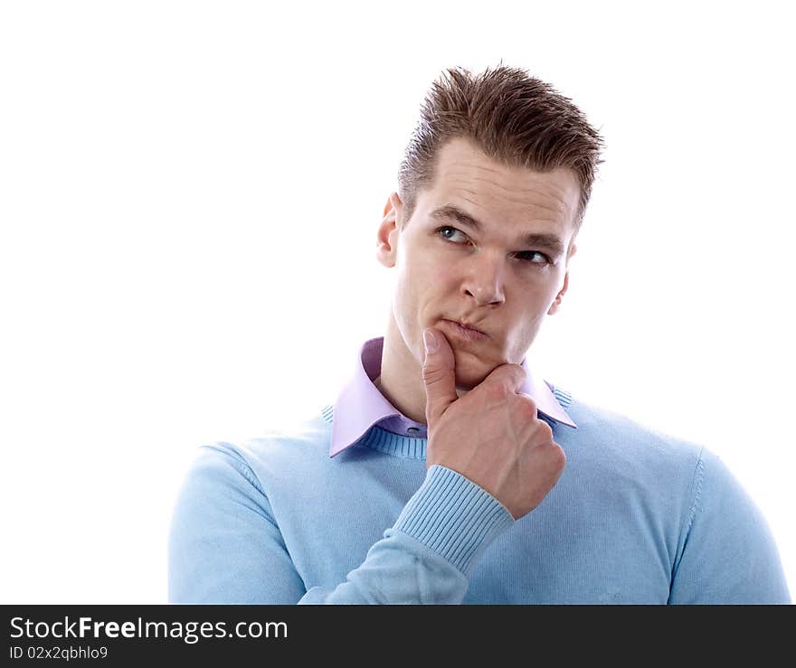 Thoughtful young man looking to the top against white background