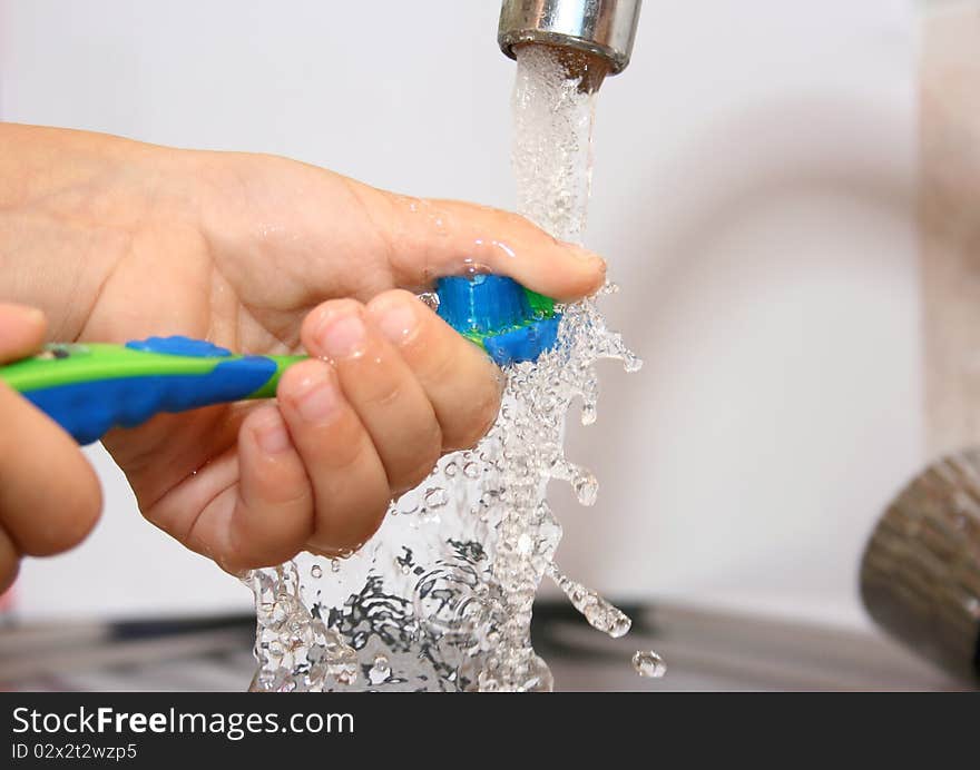 The Little Boy Washes A Tooth-brush