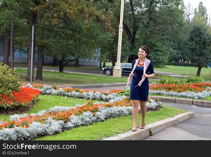 Pretty girl walking in autumn park