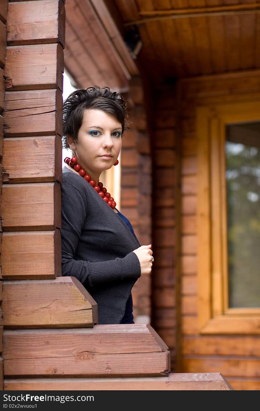 Girl standing on a veranda. Girl standing on a veranda