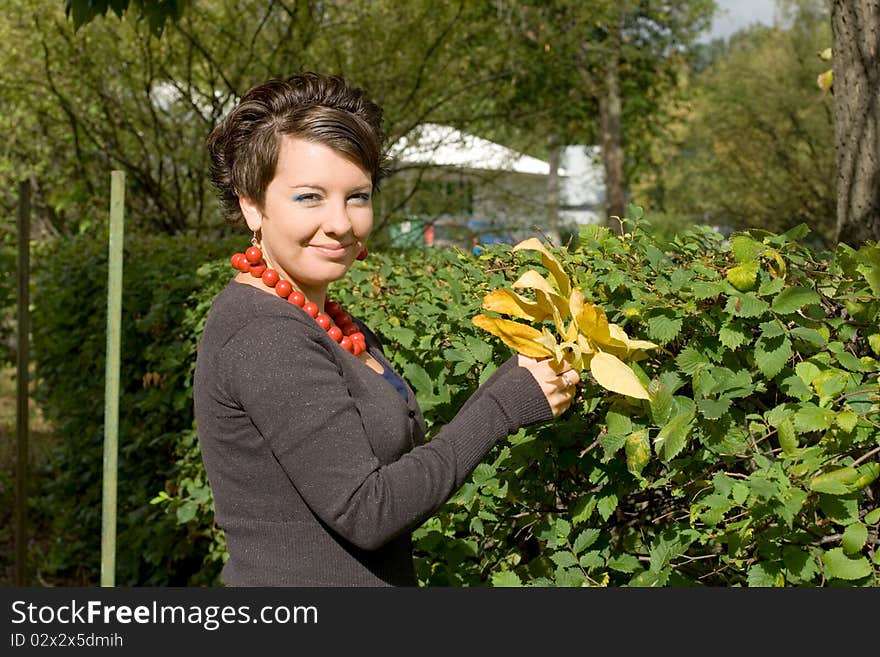 Pretty girl in autumnal garden