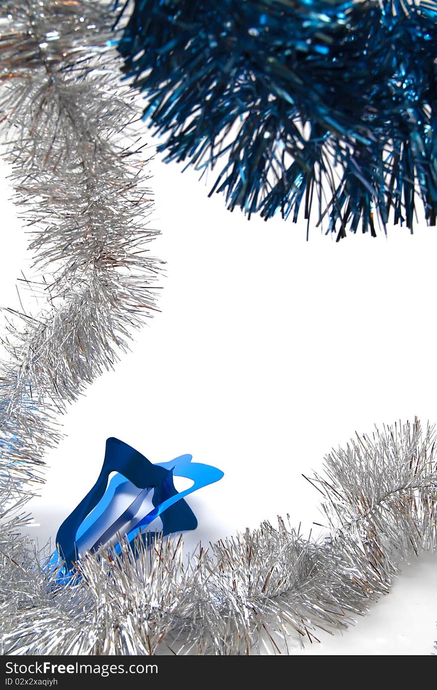 Christmas tinsel - silver and blue - on white background. Christmas tinsel - silver and blue - on white background