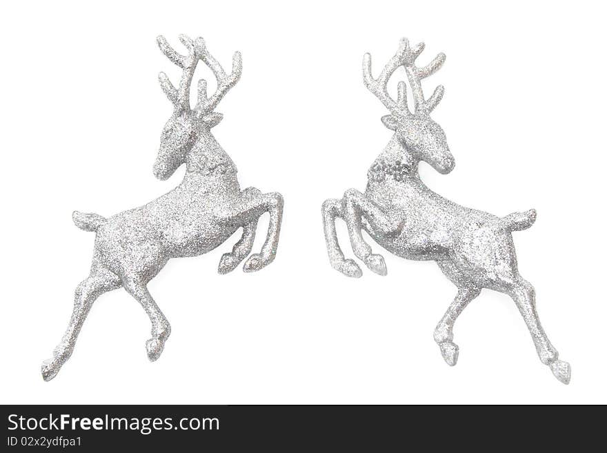 Christmas ornaments - two figures of glittering deer isolated on white. Christmas ornaments - two figures of glittering deer isolated on white