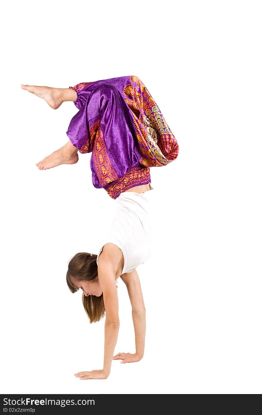 Girl in ethnic clothes standing on hands