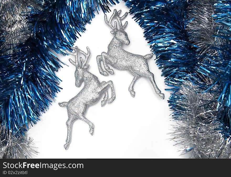 Christmas decorations with tinsels and silver deer. Christmas decorations with tinsels and silver deer