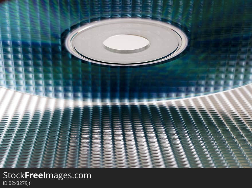 CD skewed with the reflection of a metal texture