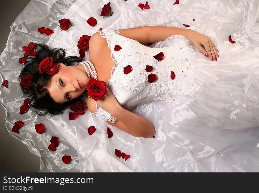 young bride with red roses. young bride with red roses