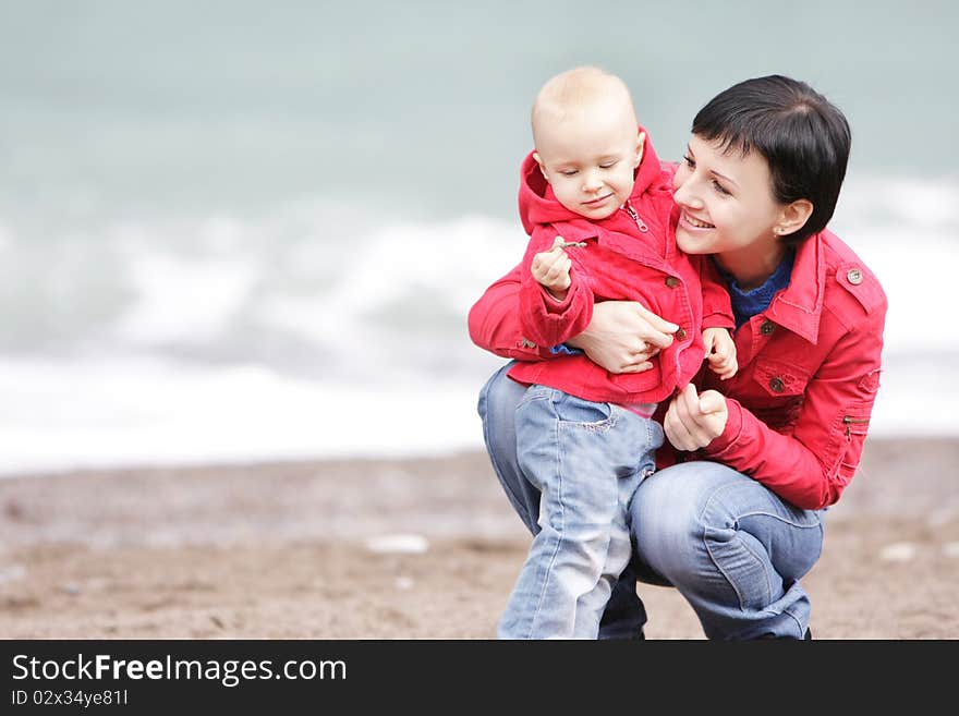 Loving mother and child on sea background