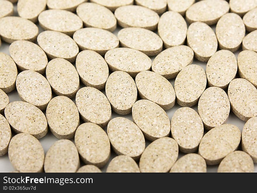 Heap of grassy tablets on a white background it is isolated