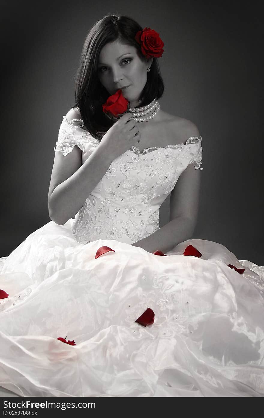 young bride with red roses