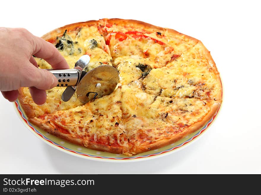 A woman cuts a slice of pizza. A woman cuts a slice of pizza