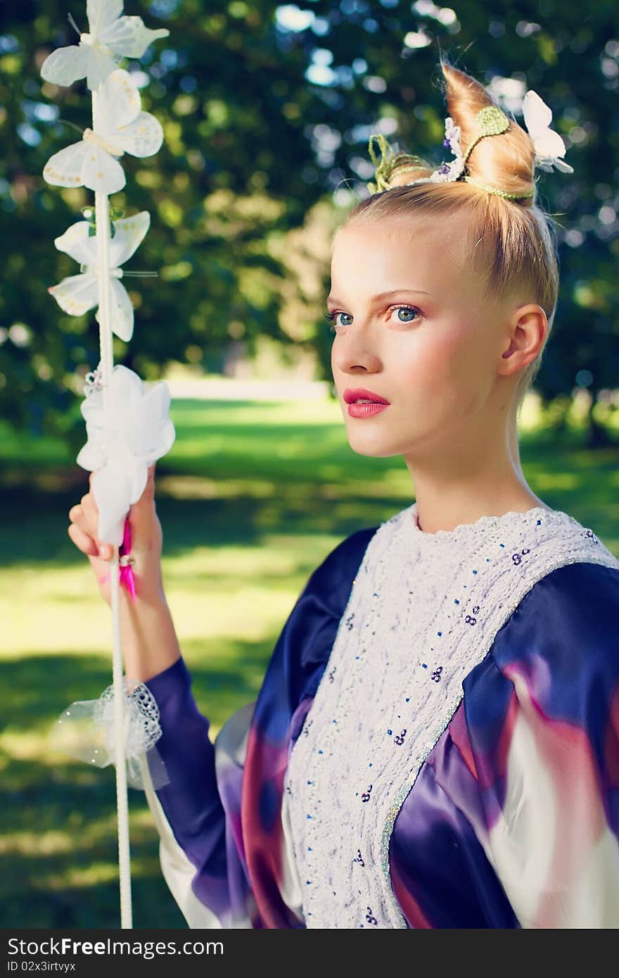 Beauty outdoor portrait with defocused forest background