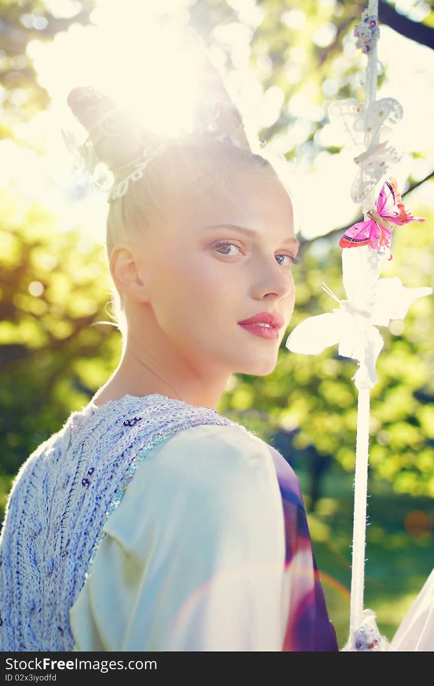 Beauty outdoor portrait with defocused forest background