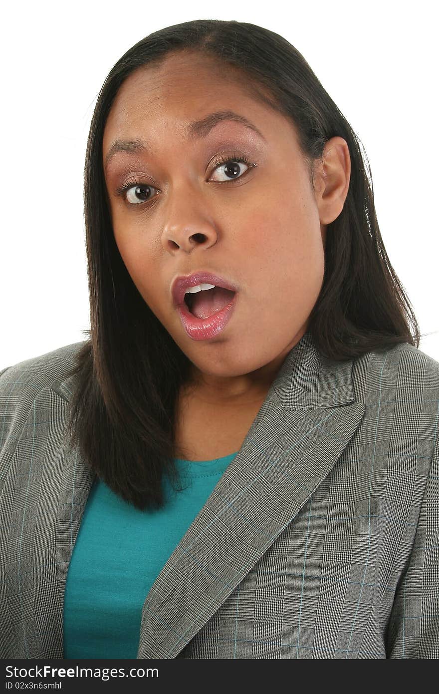 Attractive thirty year old woman in business suit with surprised expression over white background. Attractive thirty year old woman in business suit with surprised expression over white background.