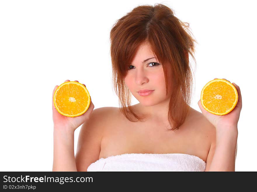 Smiling young healthy woman holding the orange isolated on white. Smiling young healthy woman holding the orange isolated on white