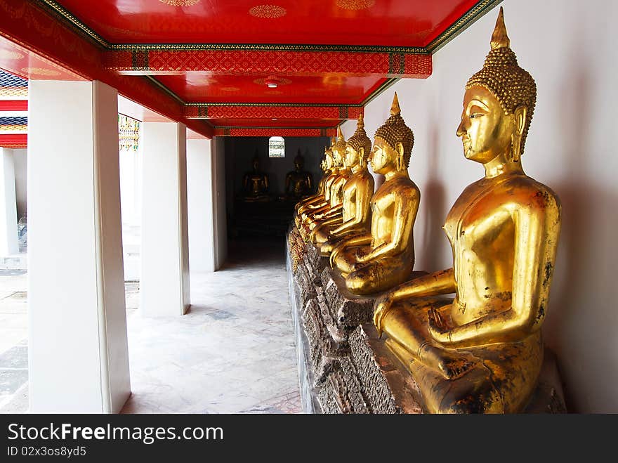 Row of Golden Buddha statue in Thailand Buddha Temple