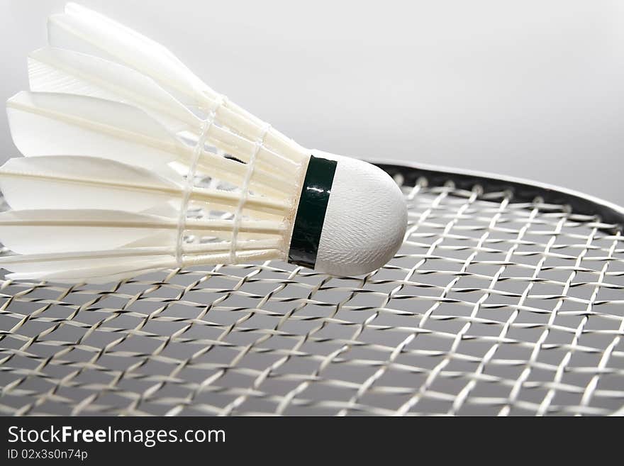 Close-up of badminton shuttlecock on the racket. Horizontal. Close-up of badminton shuttlecock on the racket. Horizontal