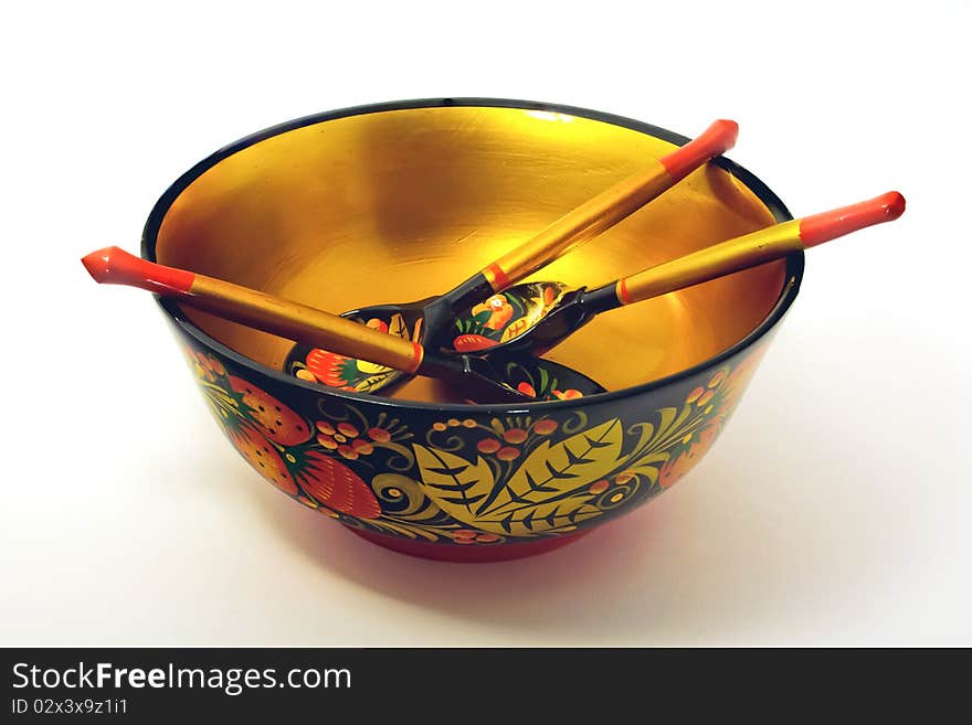 Khokhloma bowl and three Khokhloma tea spoons. Khokhloma bowl and three Khokhloma tea spoons.