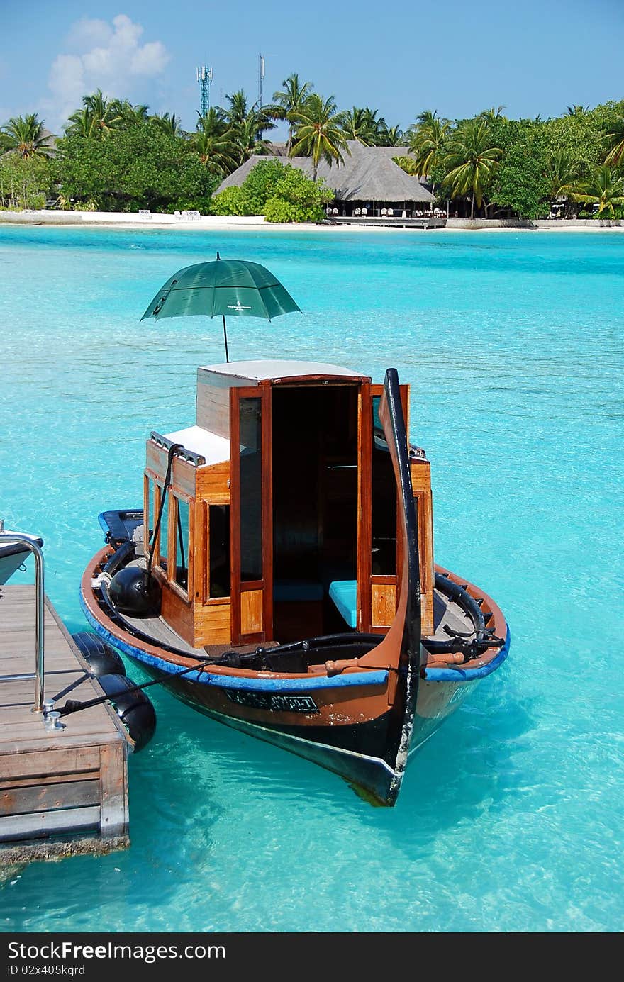 Boat in a crystal water of indian ocean in Maldives. Boat in a crystal water of indian ocean in Maldives