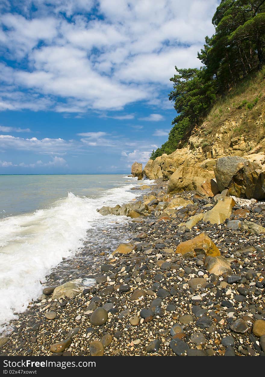 Seacoast summer landscape with rocks and sky. Seacoast summer landscape with rocks and sky