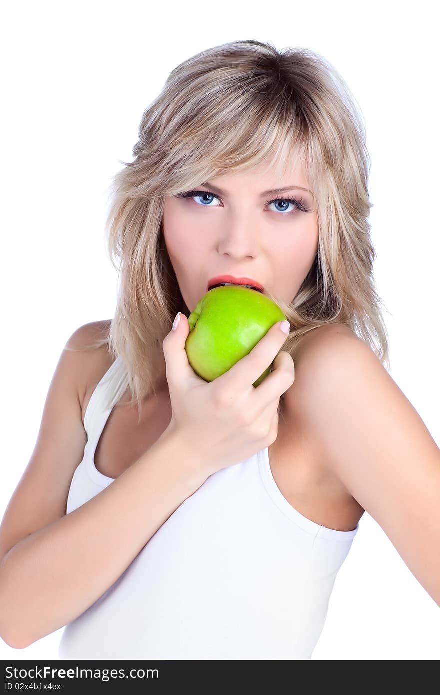 Young girl over white background with apple. Young girl over white background with apple