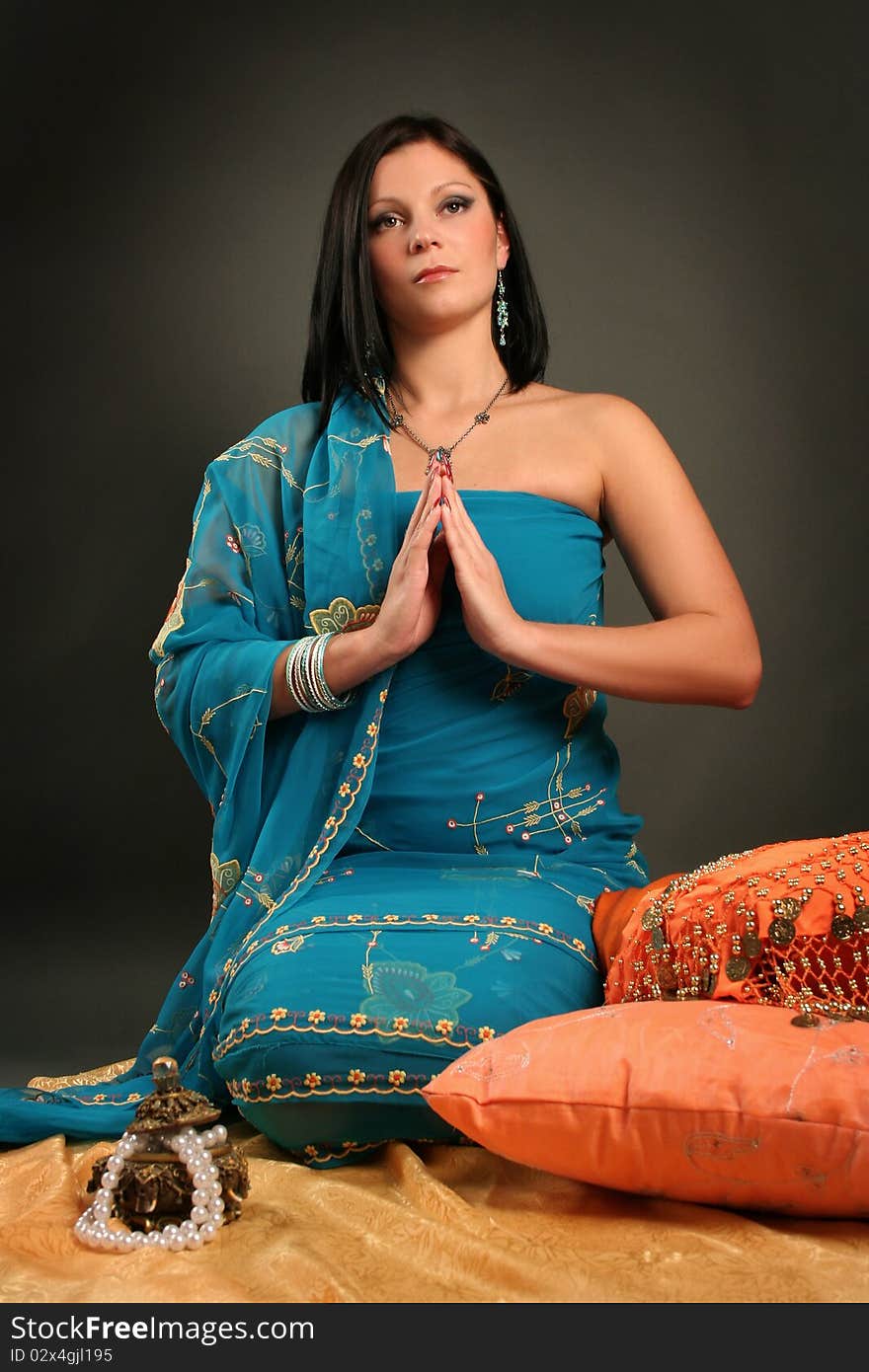 Beautiful indian woman laying in ethnic interior. Beautiful indian woman laying in ethnic interior